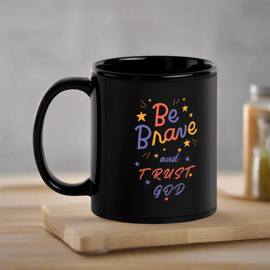 Be Brave and Trust God Black Glossy Mug - Front view with flower design and faith-based message